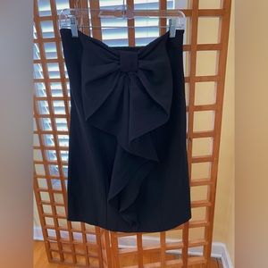 Black mini strapless dress (just above the knee)